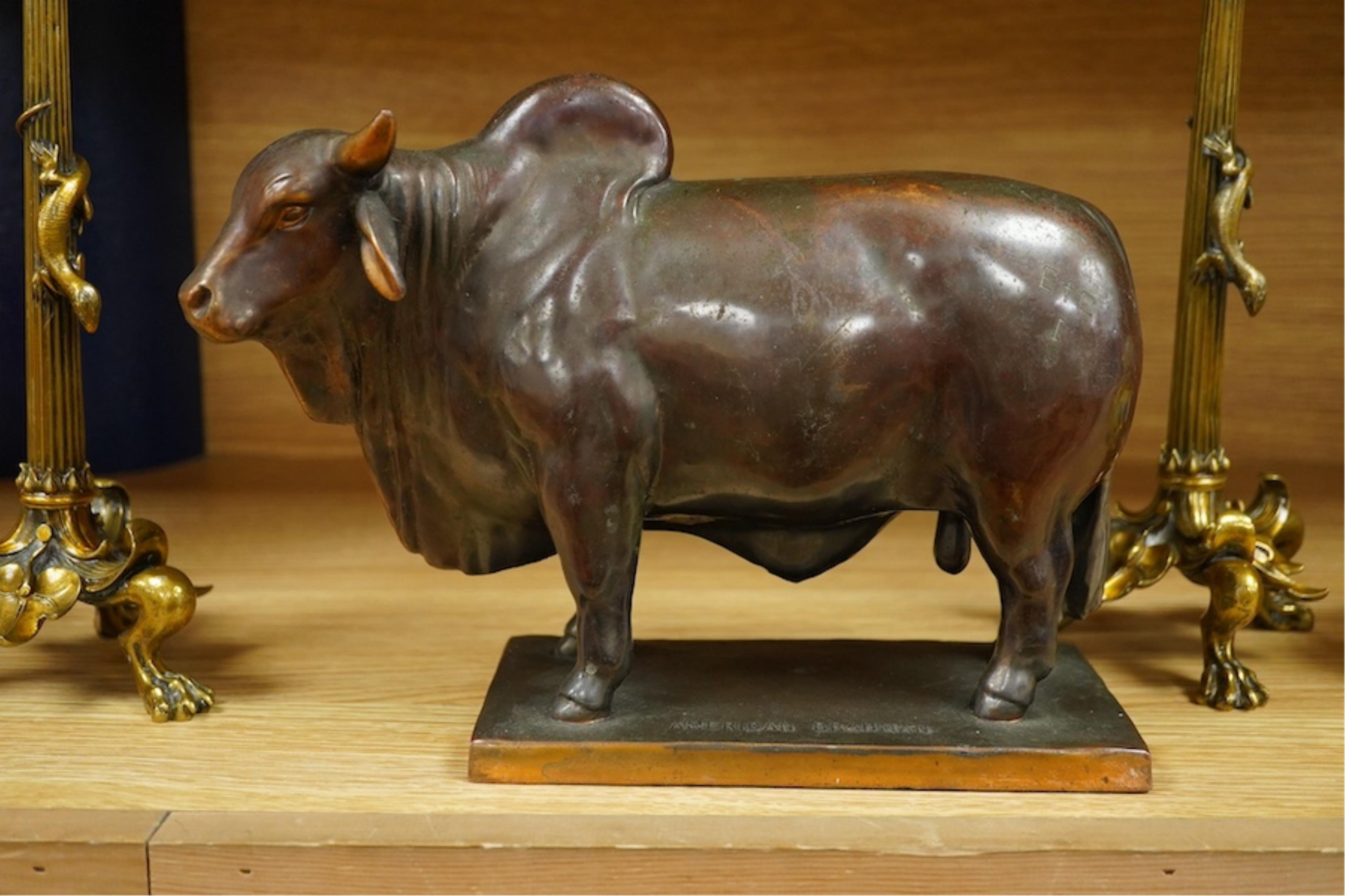 A patinated copper study, 'American Brahman', inscribed EtC, together with a pair of 19th century ormolu candlesticks, largest 30cm high. Condition - fair, bull missing one horn
